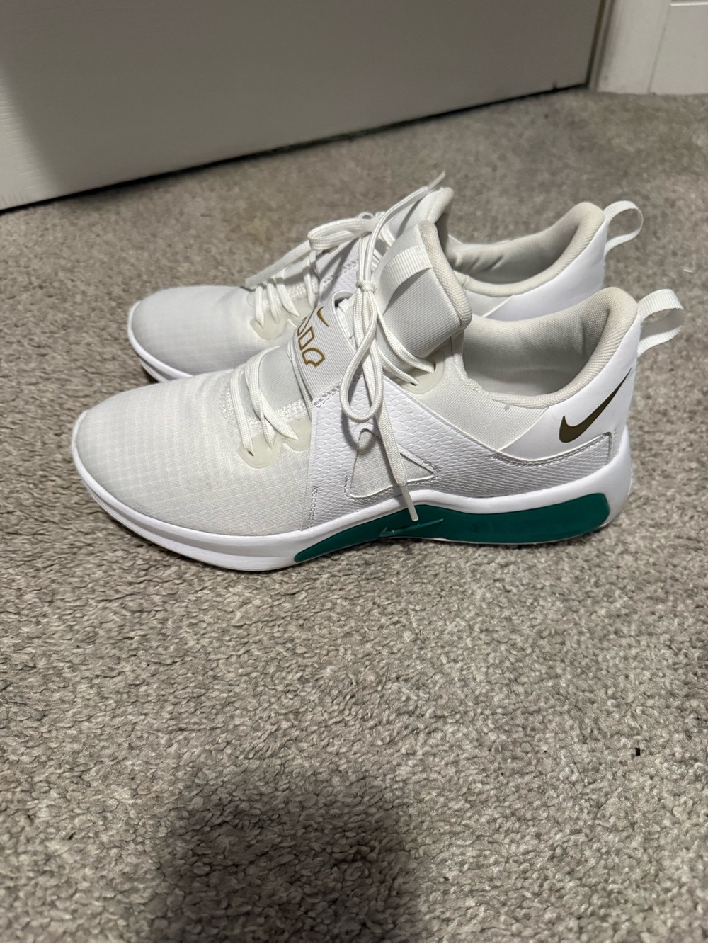 Nike Women's White Sneakers with Teal and Gold Accents